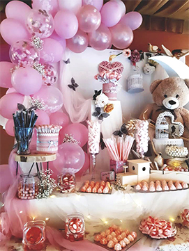 Mesa dulce en tonos rosas para bautizo